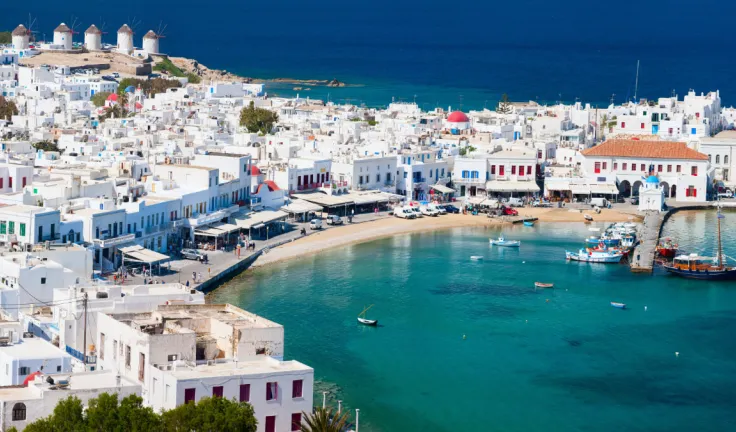 Panorama of traditional greek village with white houses on Mykonos Island