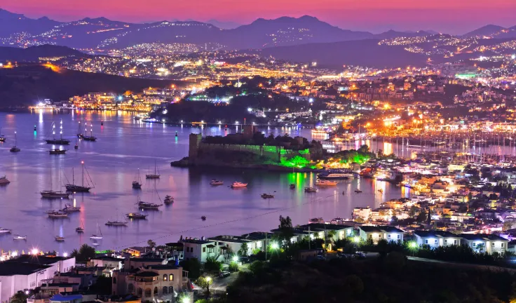 View of Bodrum harbor and Castle of St. Peter by night. Turkish Riviera