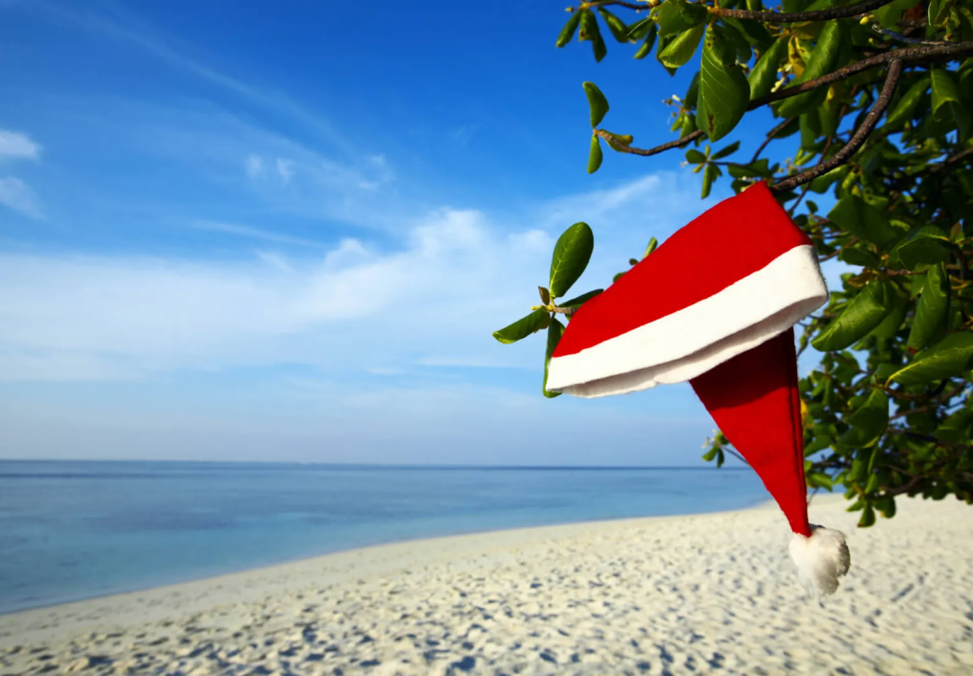 Christmas hat on a beach