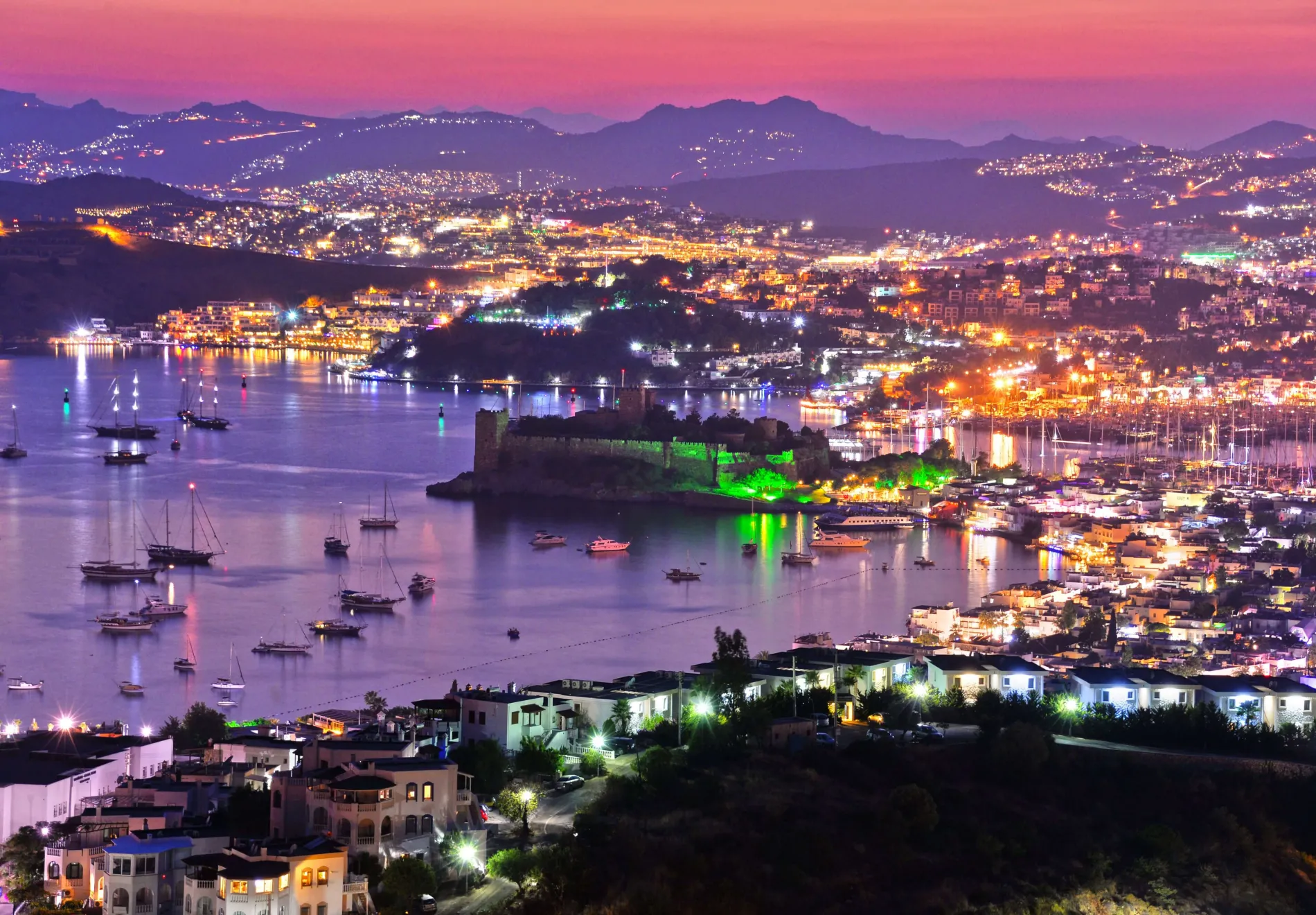 View of Bodrum harbor and Castle of St. Peter by night. Turkish Riviera