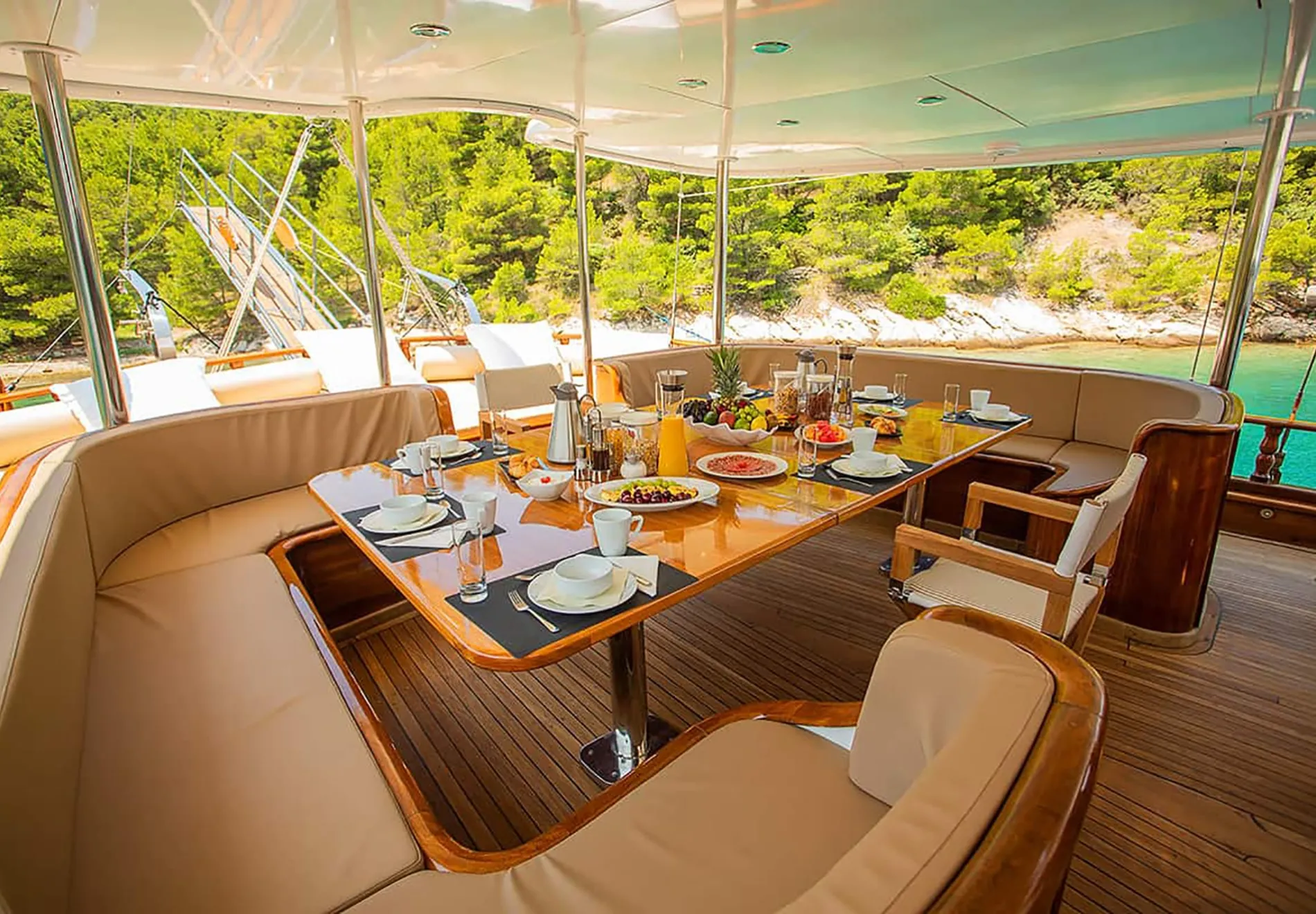 Guests can indulge in gourmet meals at one of the yacht’s two convertible dining tables, set in sun or shade as desired. The