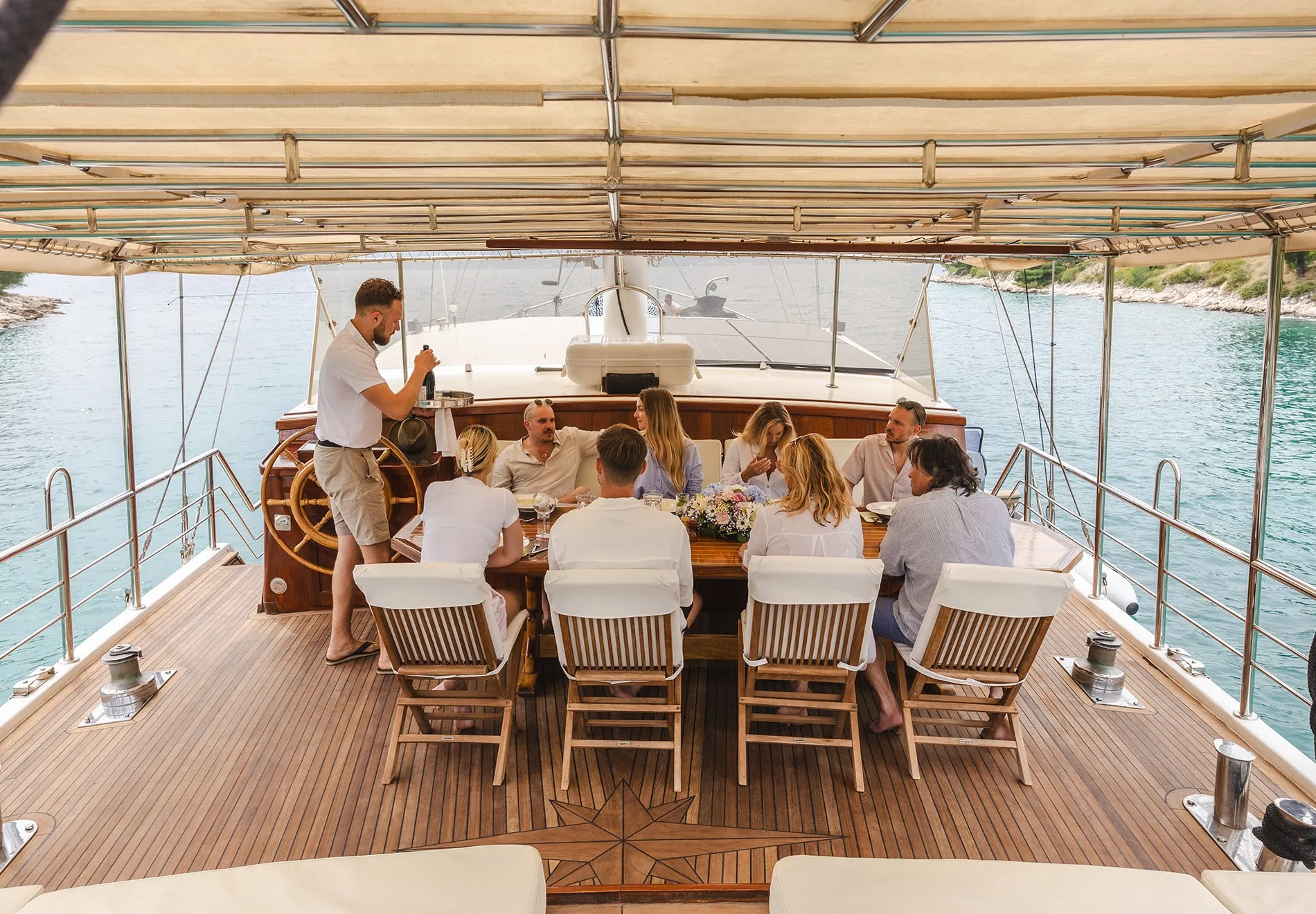 On deck, enjoy a shaded dining area, a padded seating space for cocktails, and sun mattresses for sunbathing or stargazing