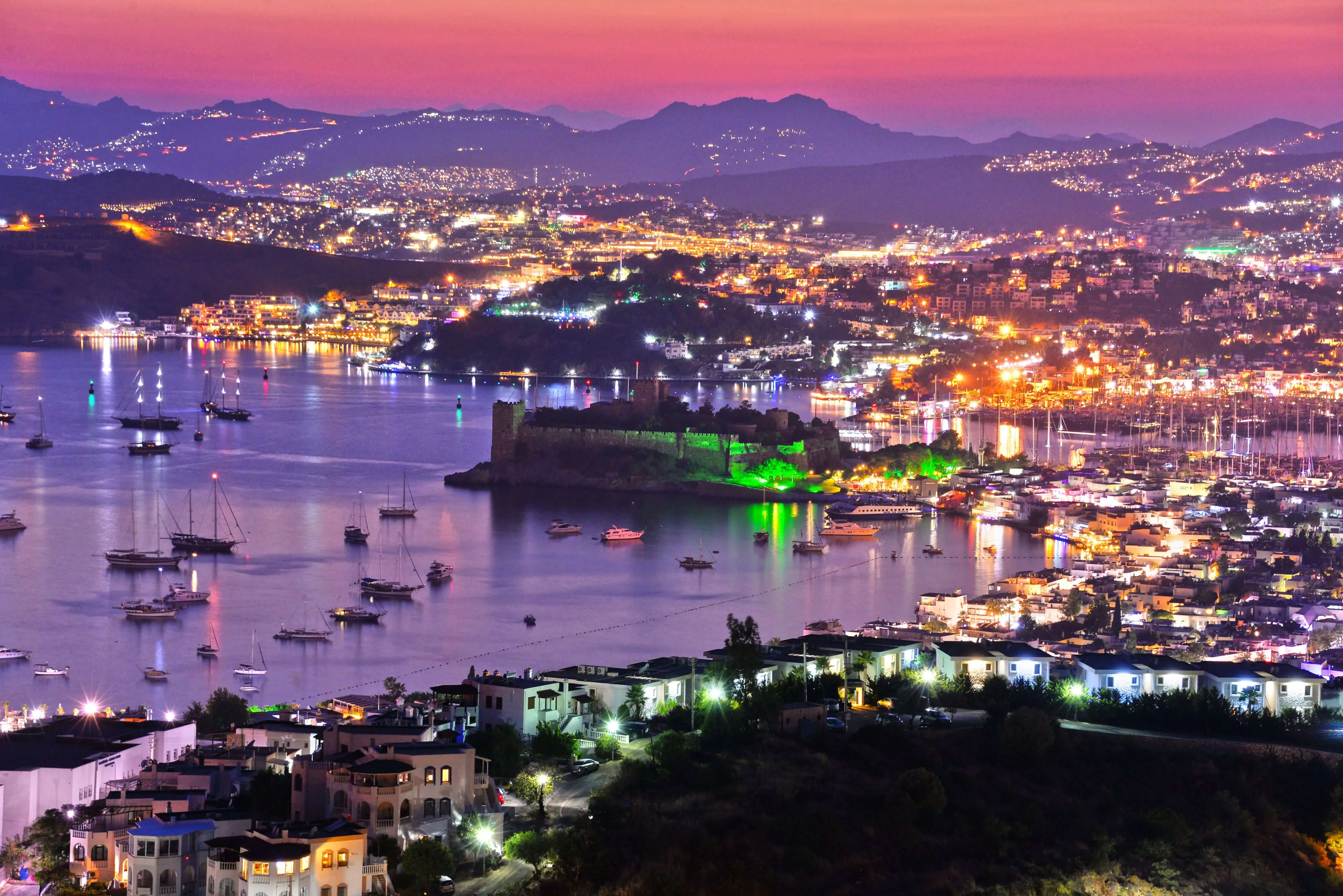 View of Bodrum harbor and Castle of St. Peter by night. Turkish Riviera