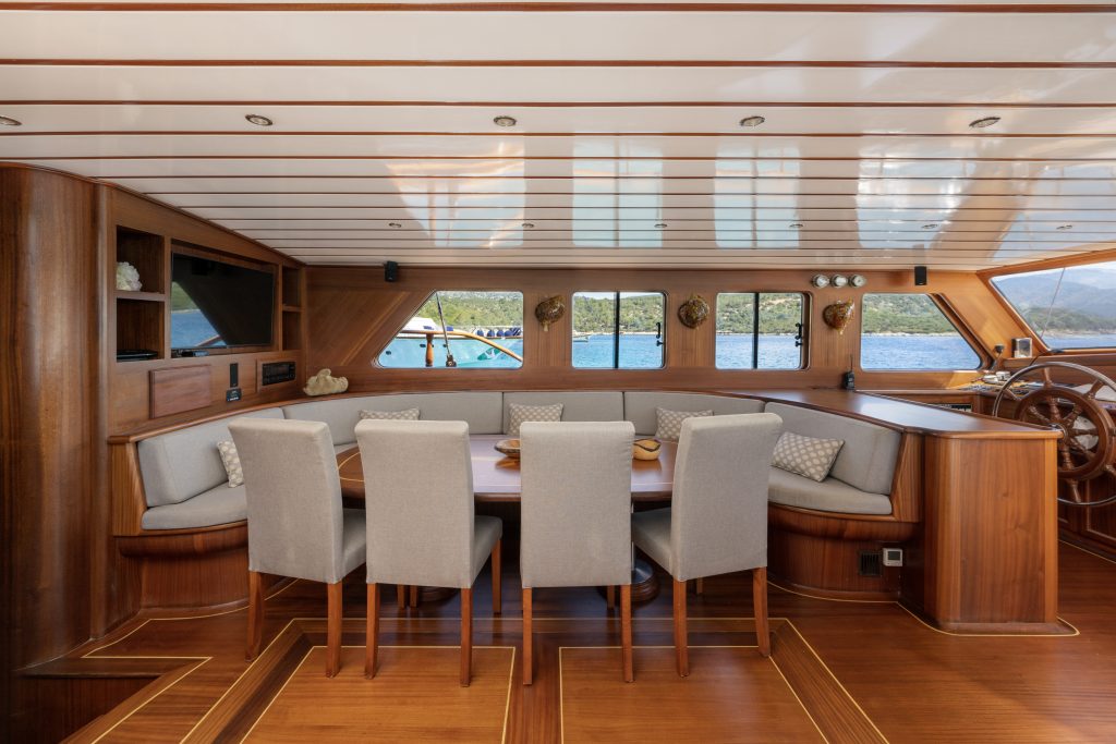 A table and chairs in a boat.