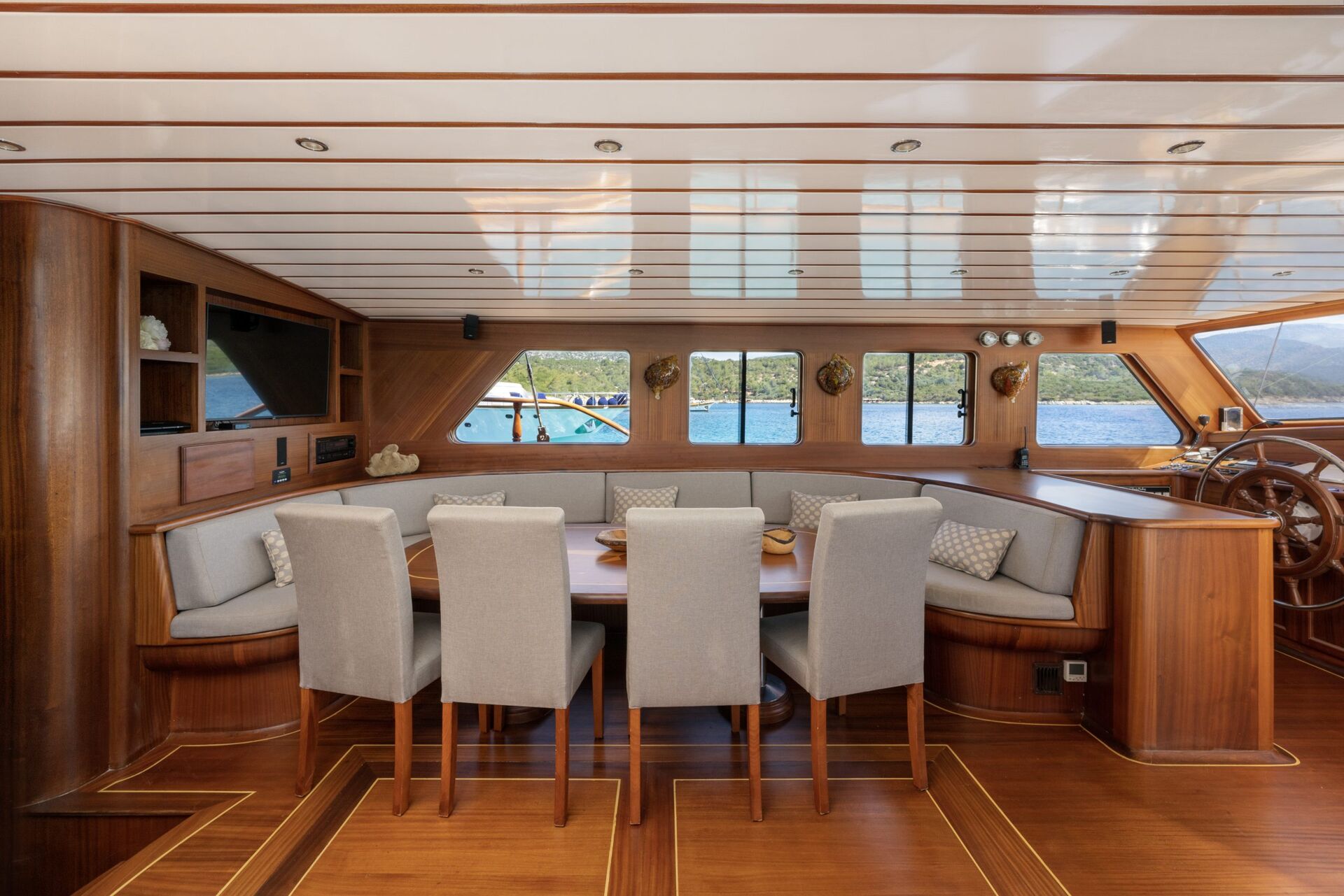 A table and chairs in a boat.