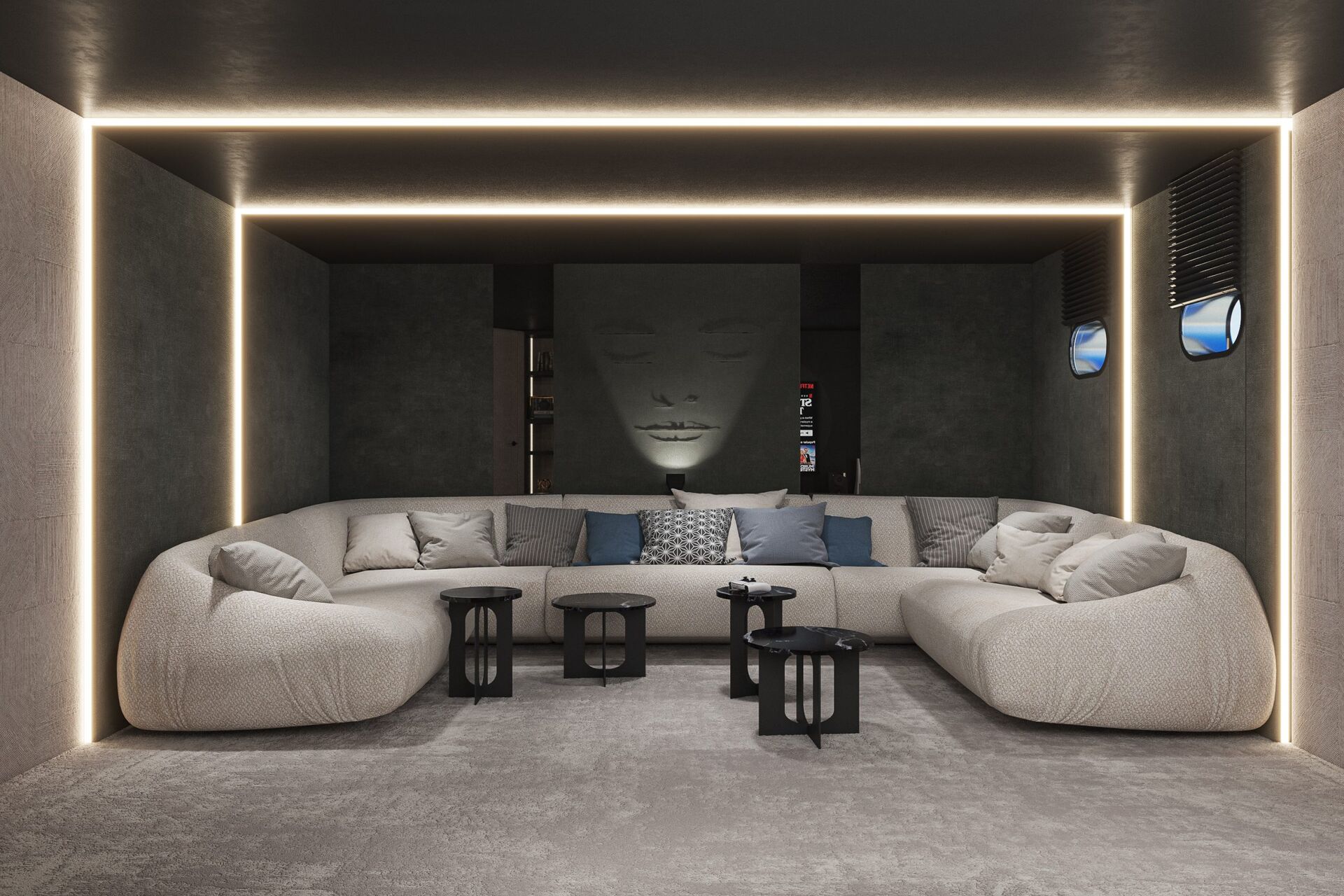 A modern lounge with a large, curved beige sofa, black side tables, and soft lighting outlining the ceiling and walls. A serene face artwork decorates the dark back wall, adding a calming atmosphere.