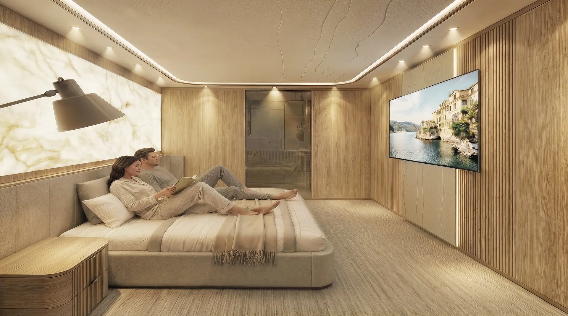 A man and woman relax on a modern bed in a cozy, wood-paneled bedroom with soft lighting, watching a scenic landscape on a large wall-mounted TV. The room features minimal decor and a warm, inviting atmosphere.