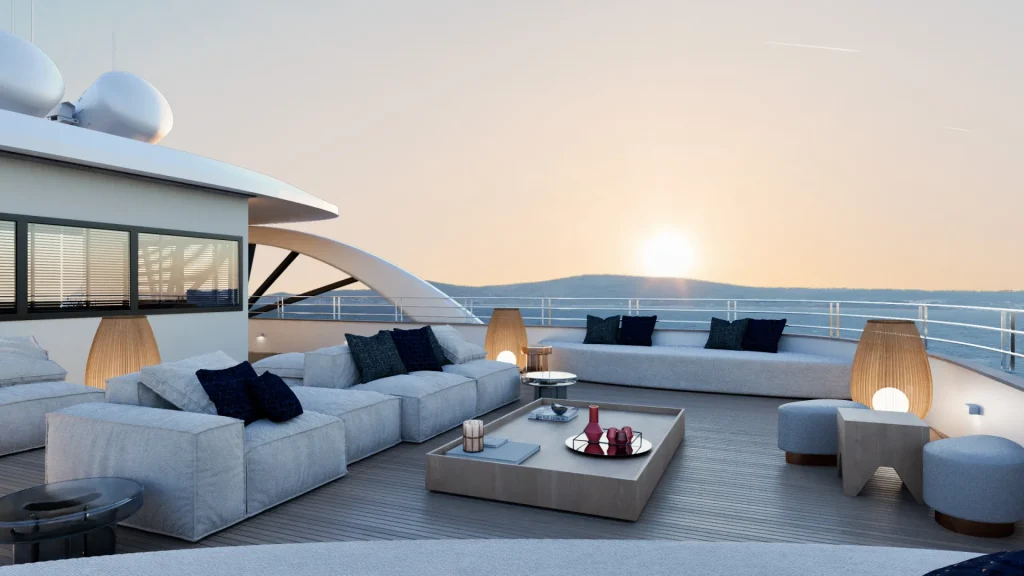PREMIER Luxurious yacht deck with modern outdoor sofas, armchairs, and tables, decorated with cushions and lanterns, overlooking a calm ocean at sunset. The sky is clear and the sun is low on the horizon.