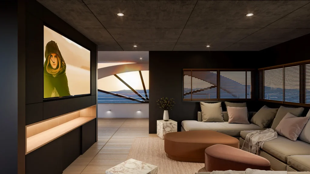 PREMIER A modern living room with neutral-toned furniture, a large TV displaying a hooded character, floor-to-ceiling windows with blinds, and a scenic sunset view over the ocean in the background.