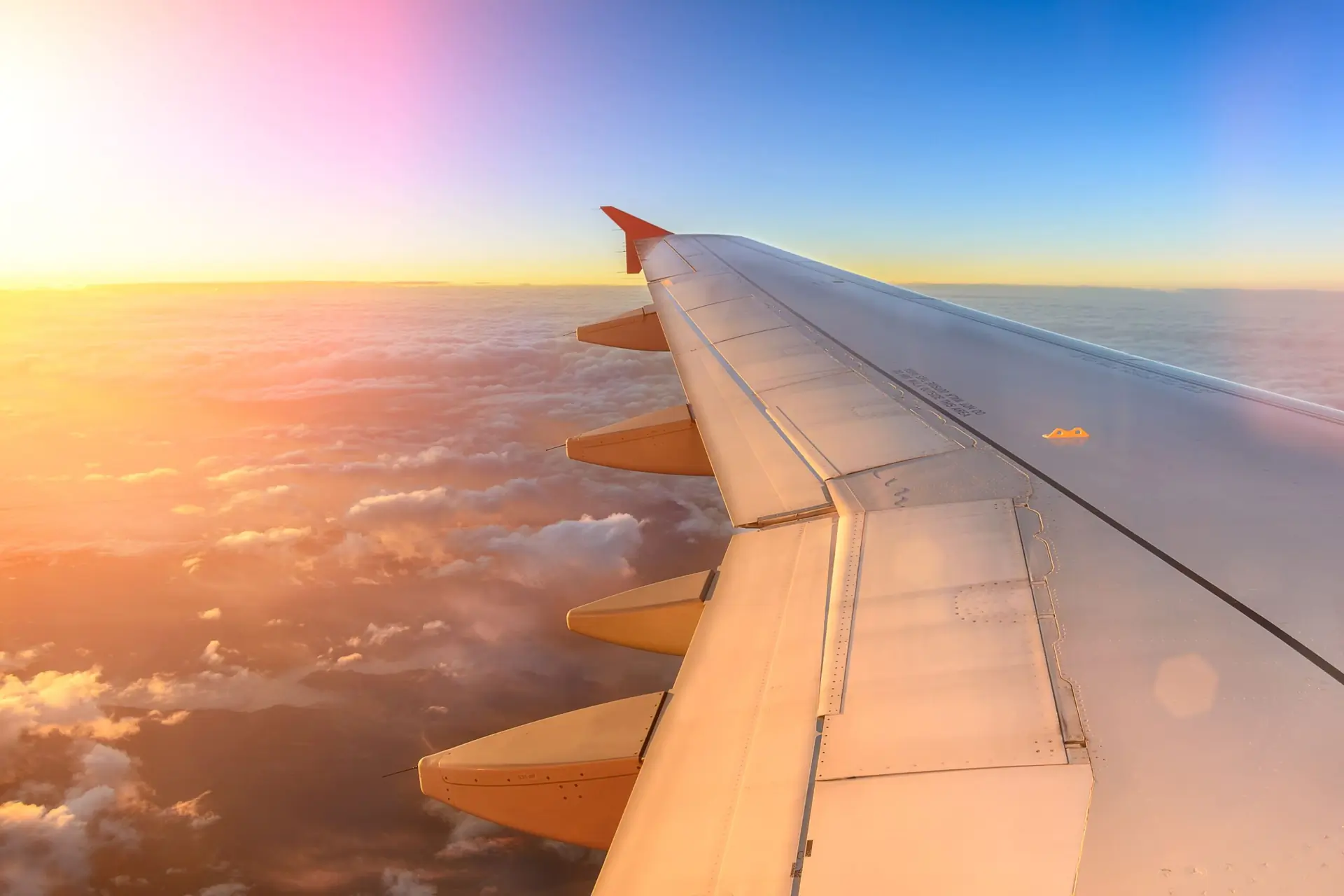 Aerial view of airplane flying. View from the plane window of emotional moment during international travel around the world