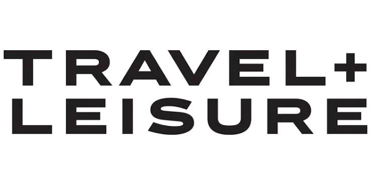 The image shows the words TRAVEL + LEISURE in bold, black, uppercase letters on a white background.